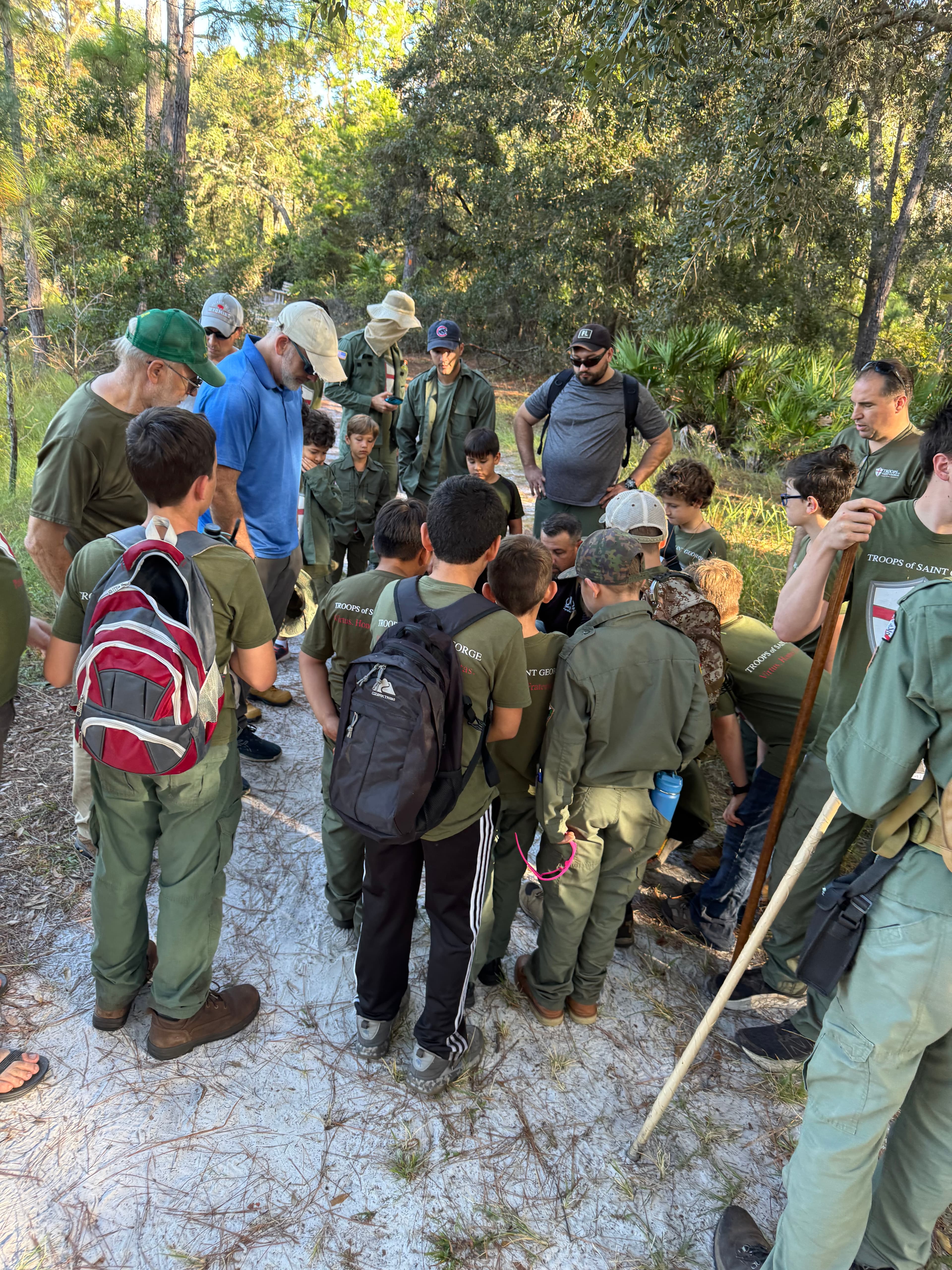 Troop 51 gathered around a trail lesson